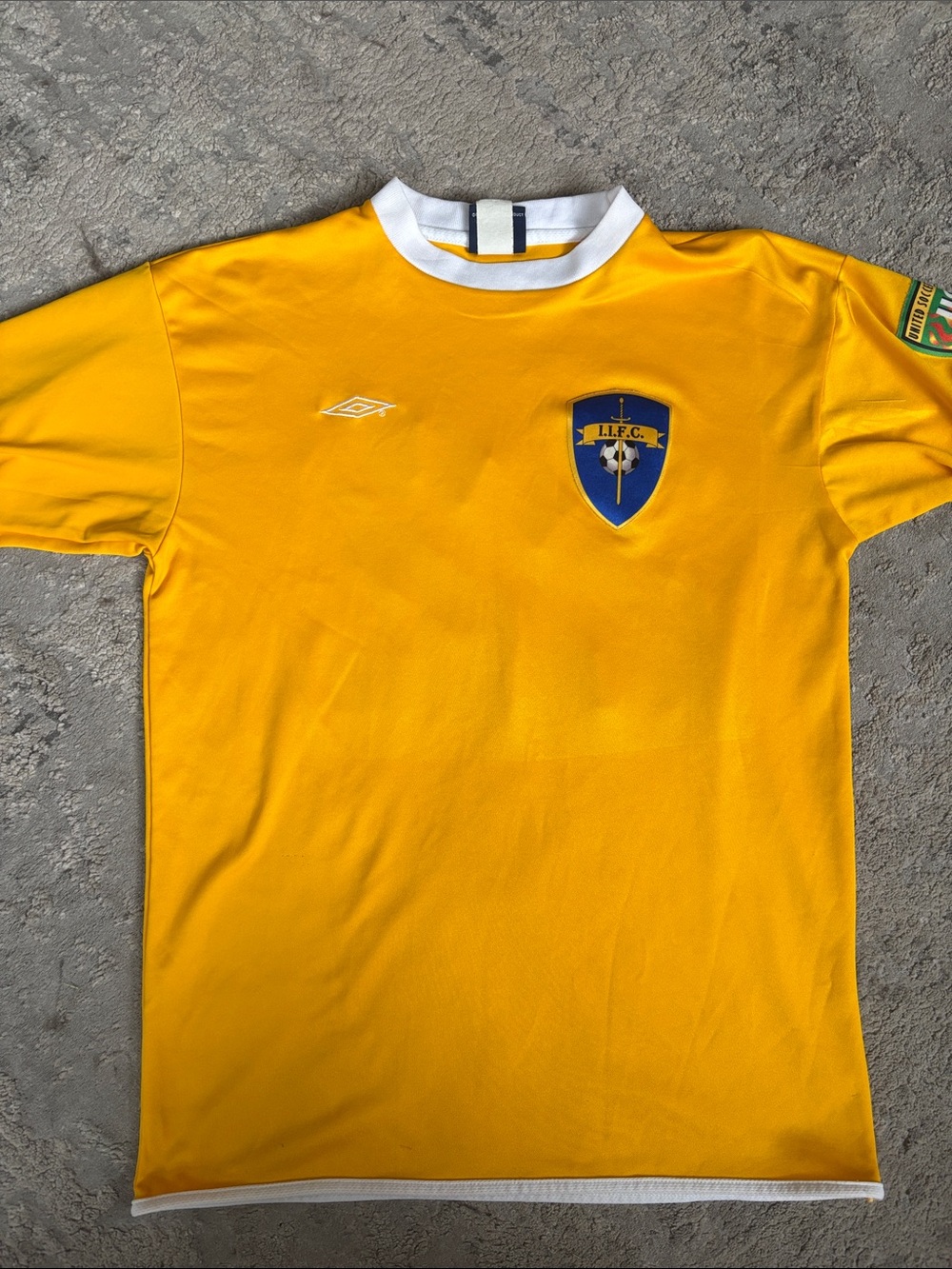Vintage Umbro Men's Yellow Football Jersey with Blue Crest